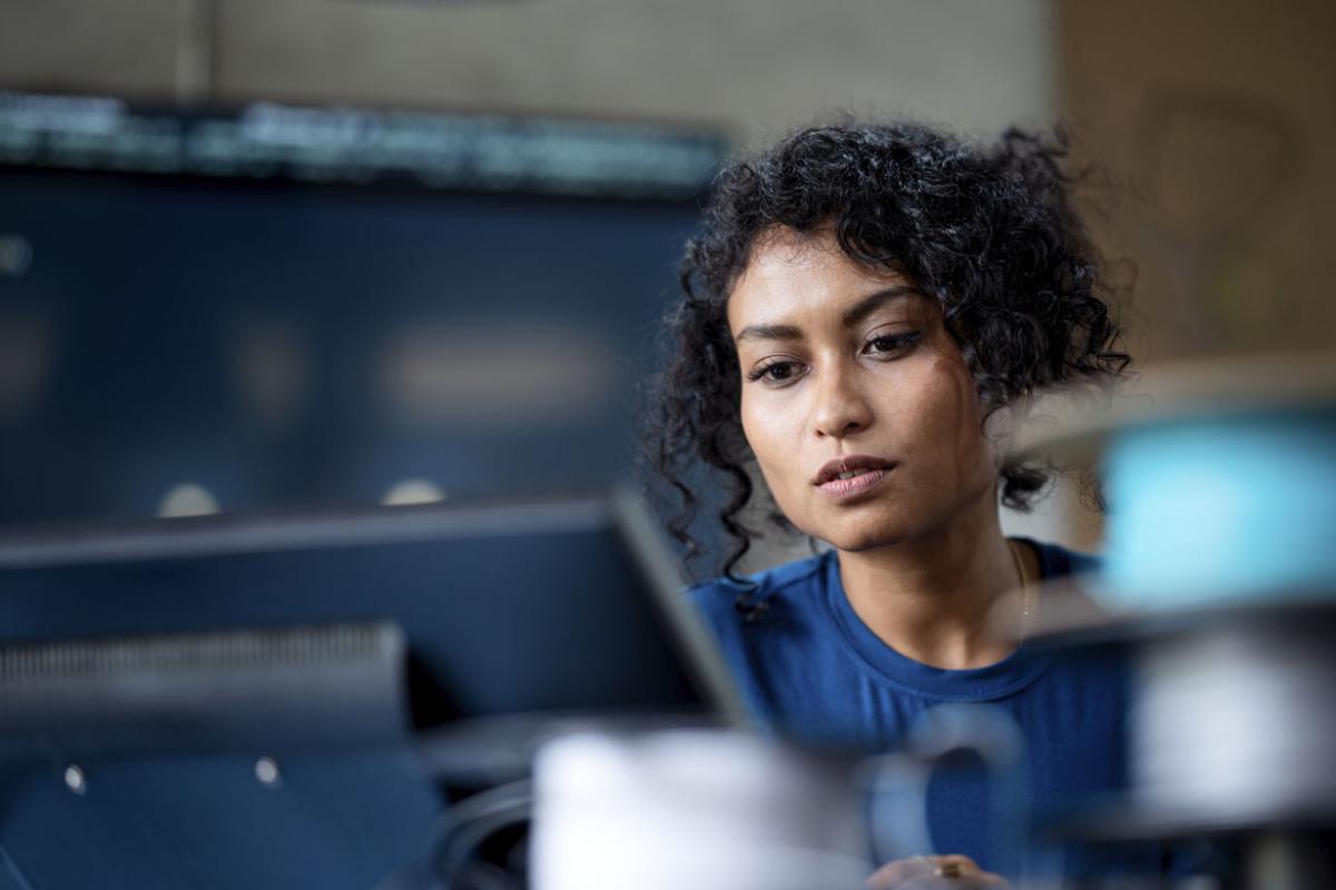 Person focuses while working at a computer