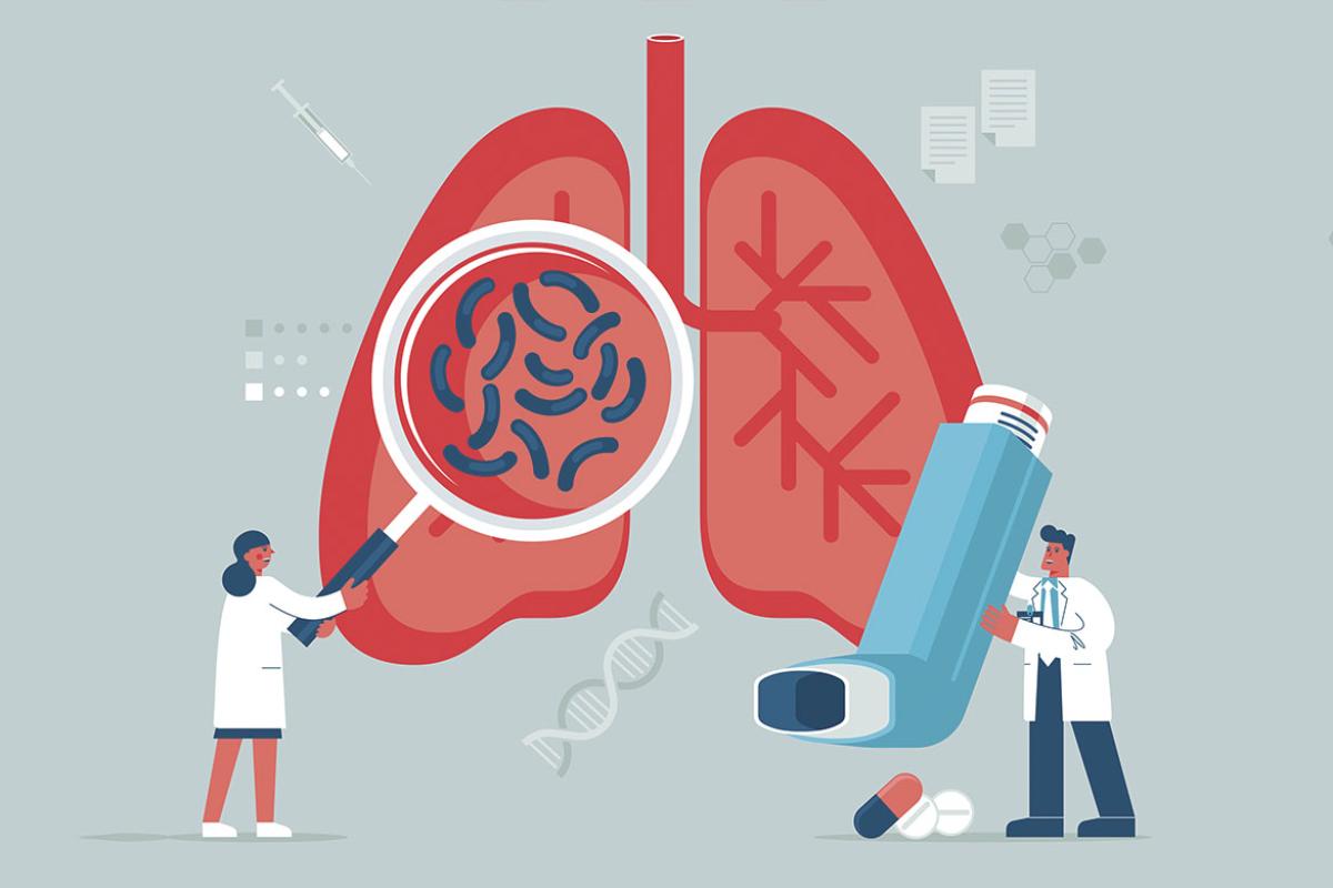 Doctor with magnifying glass near huge human lungs