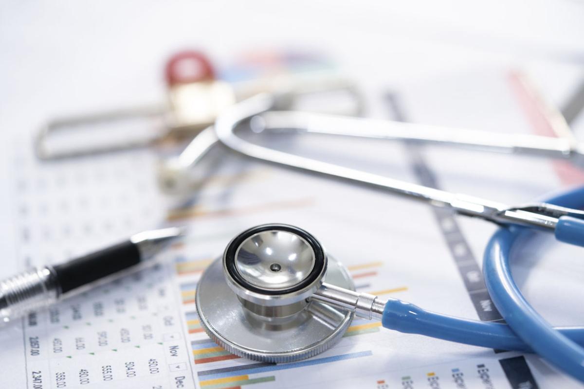 Stethoscope, pen and charts