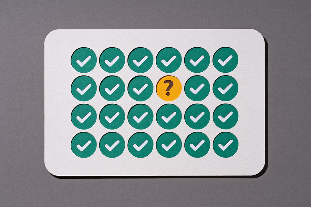 Question mark surrounded by a series of check marks