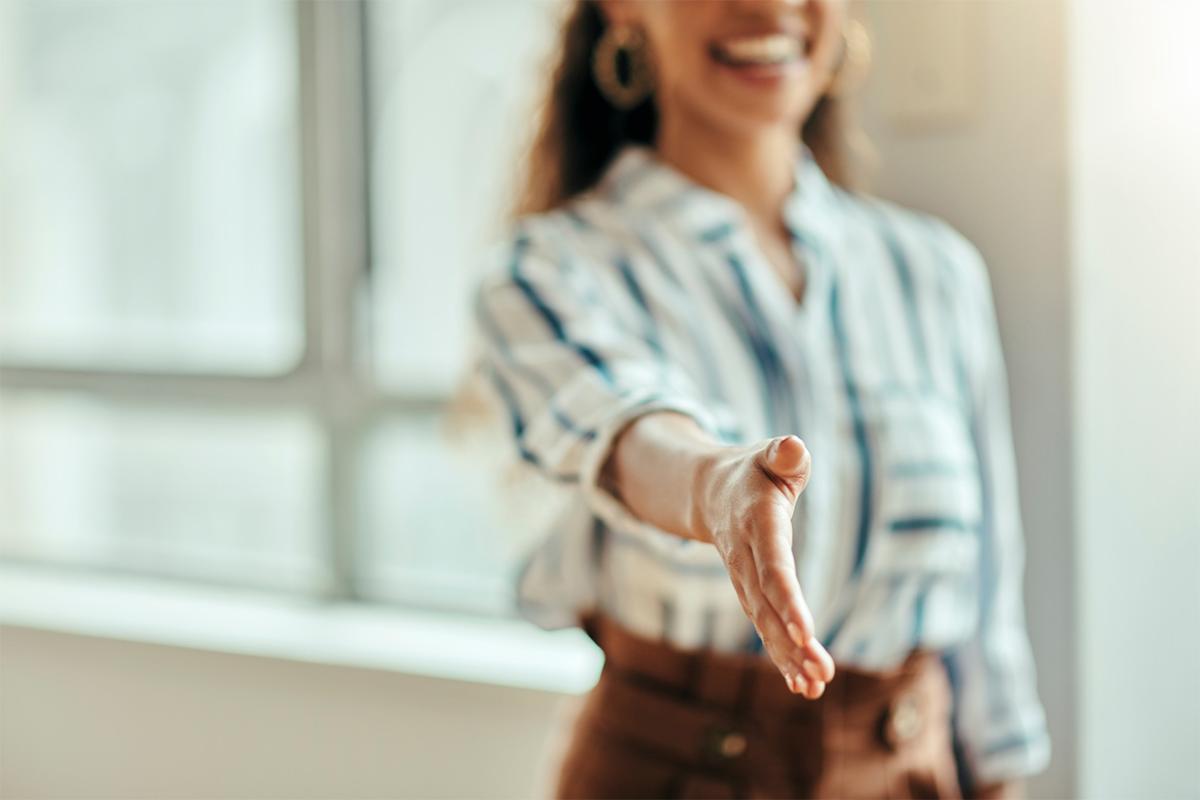 Person extending hand for a handshake