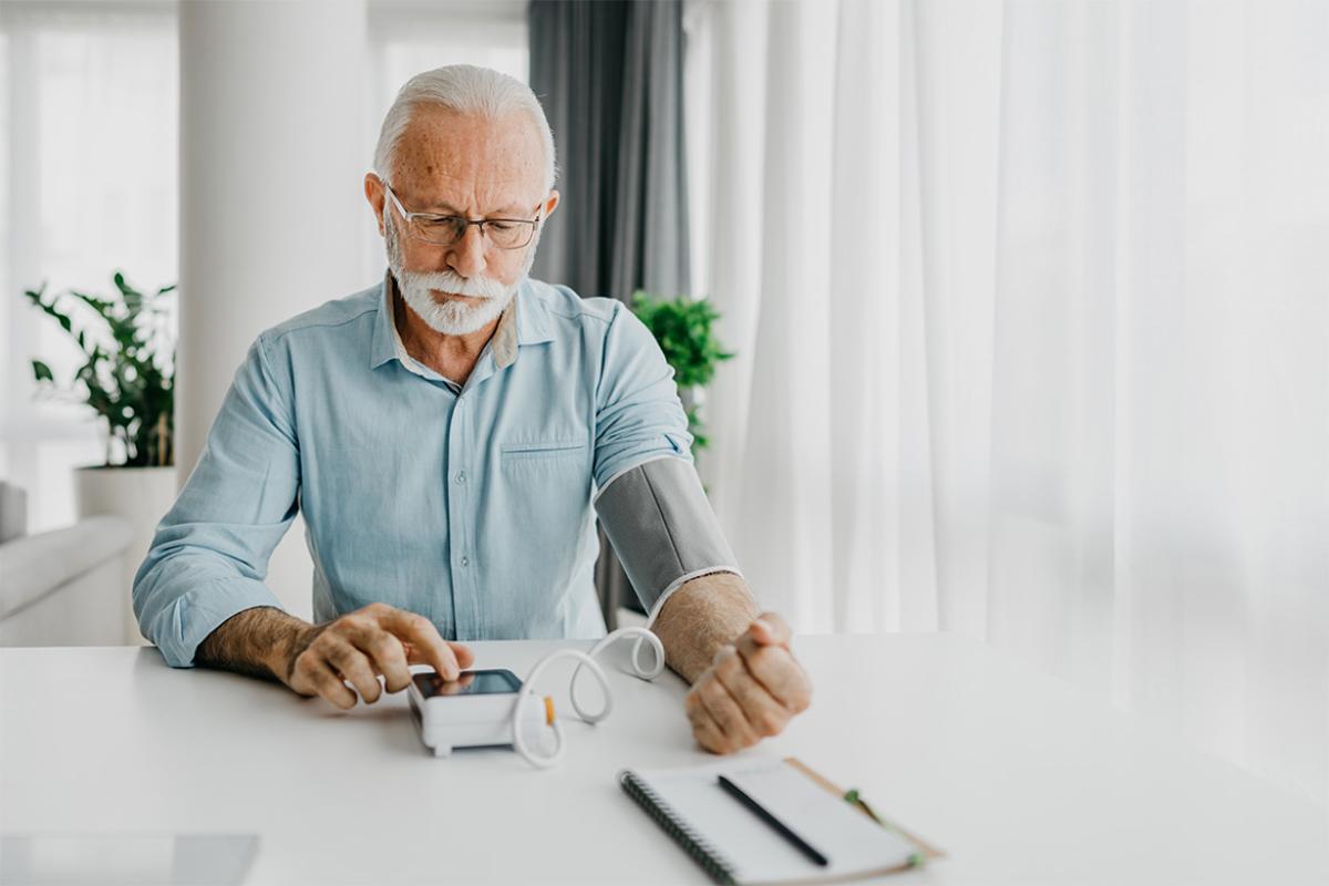Person checks blood pressure at home