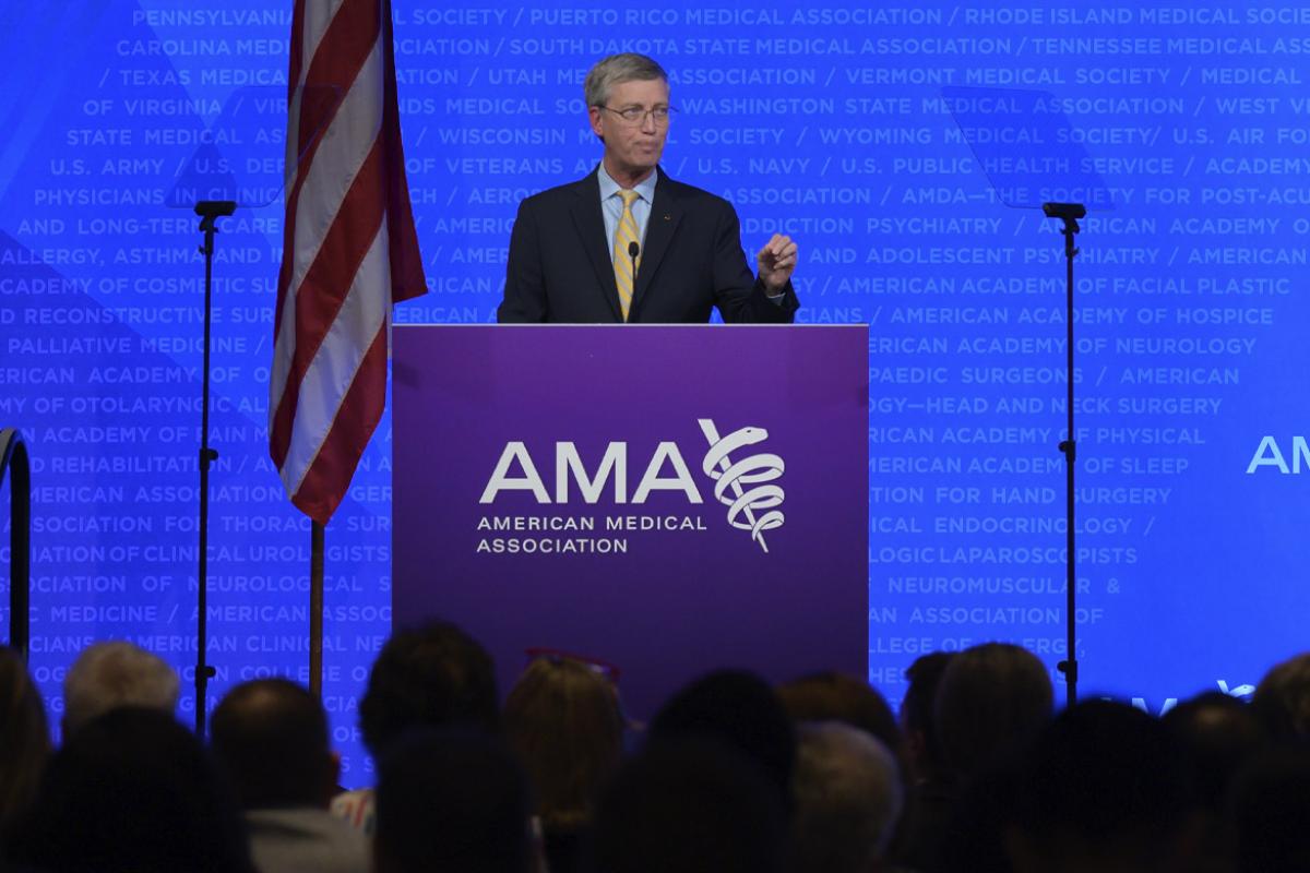 Bruce A. Scott, MD, speech at podium at the 2025 Annual Meeting of the HOD