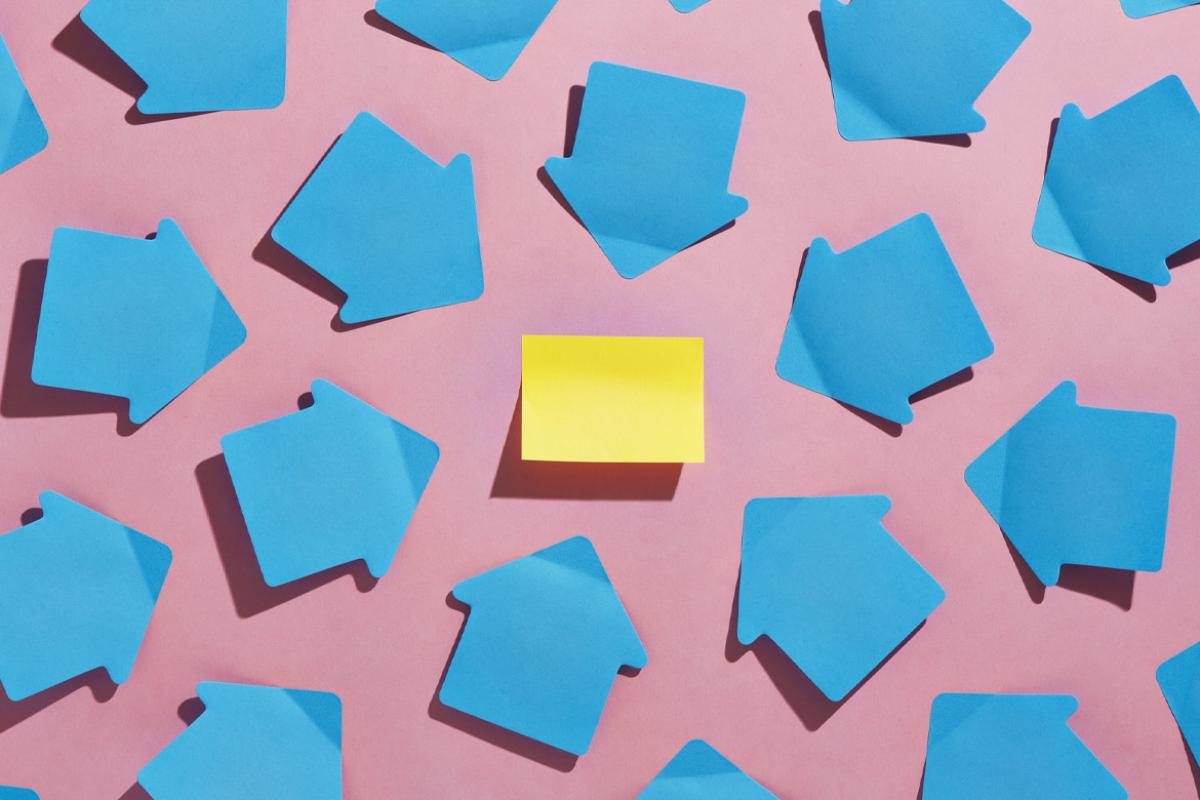 Arrows pointing toward a sticky note