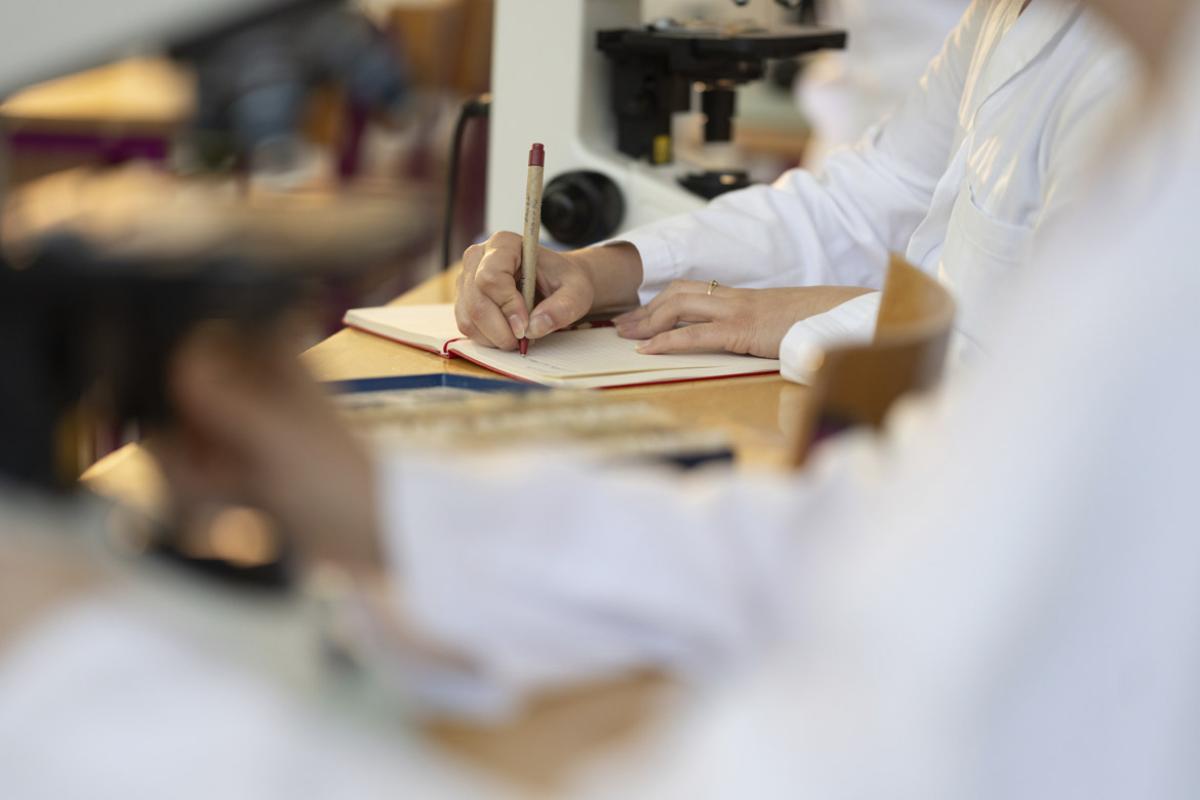 Person writes in a journal