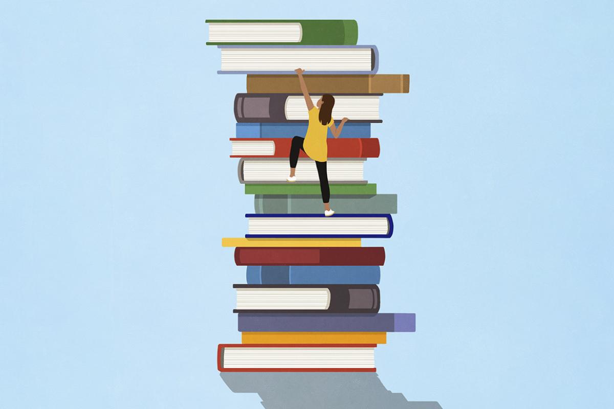 Figure climbs a giant stack of books