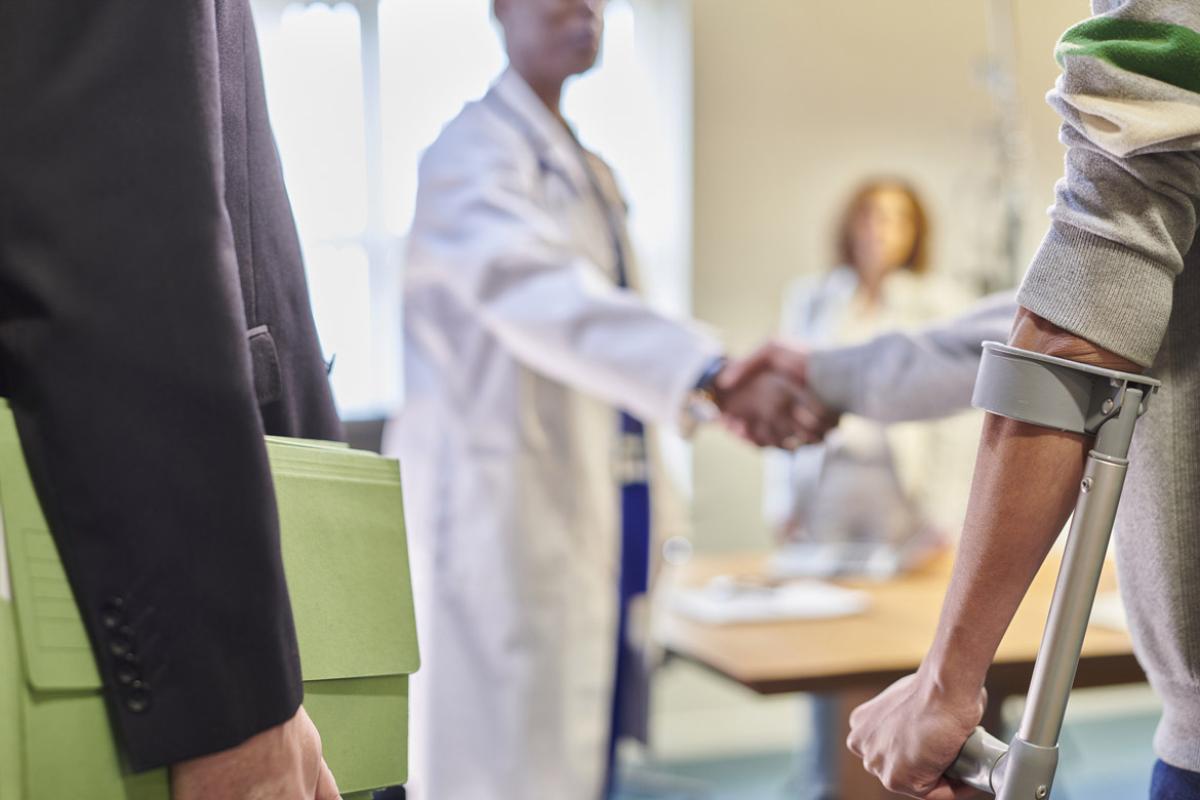 Doctor shakes hands with patient