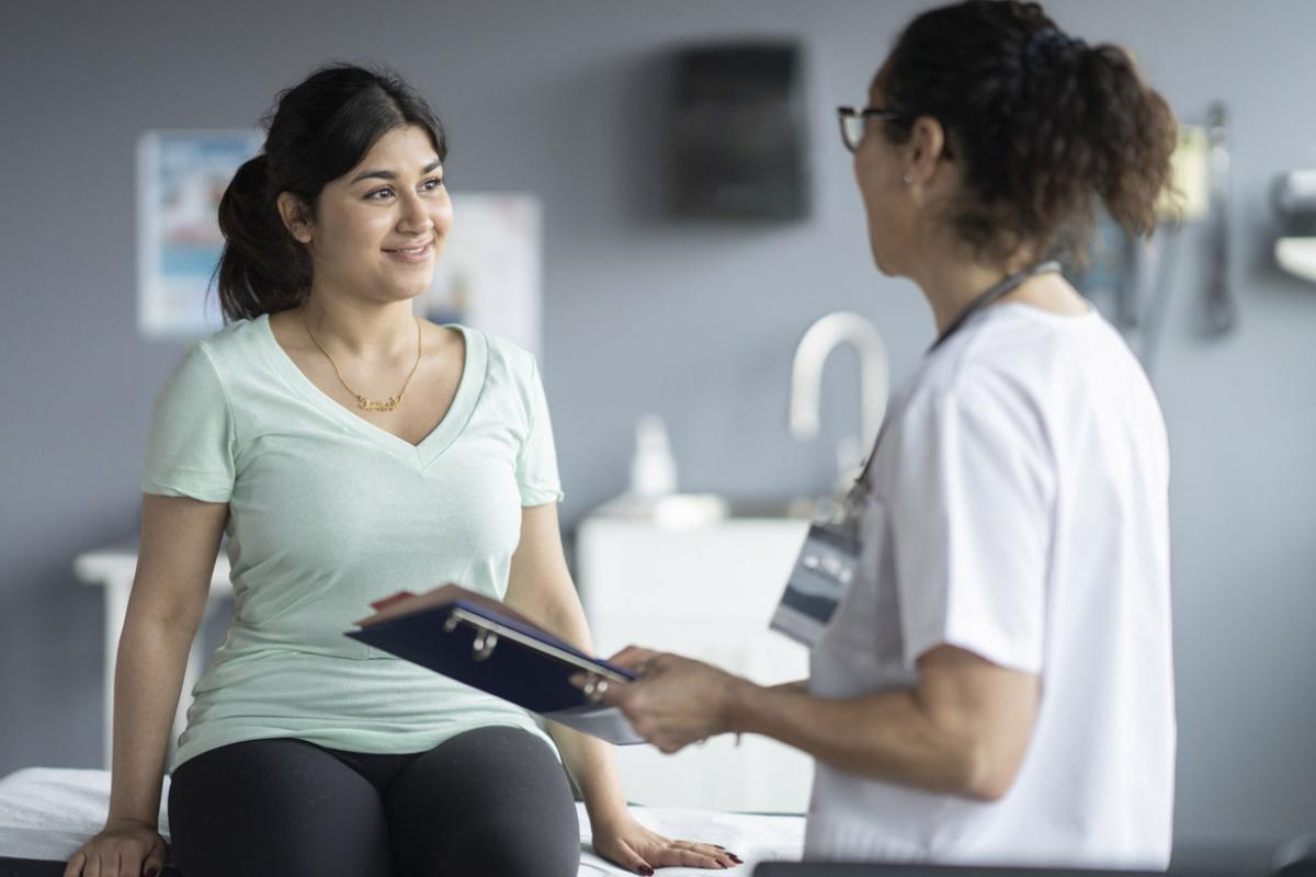 Doctor in discussion with smiling patient