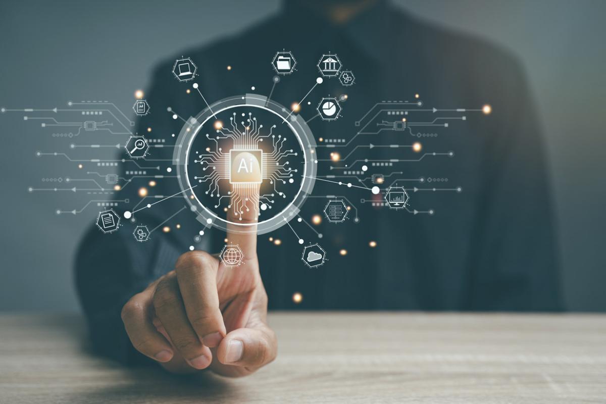 Finger on an AI button surrounded by technology icons