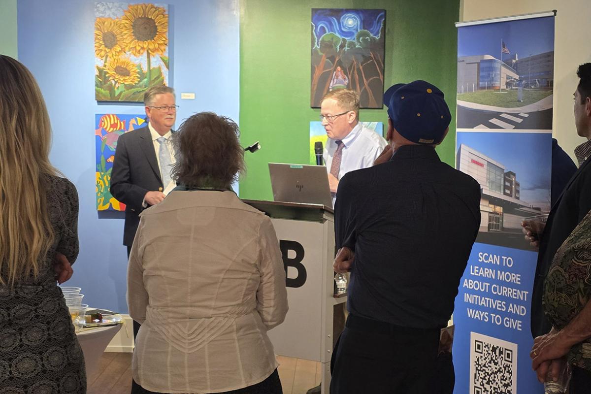 Thomas Vaughan, MD, delivers remarks at an art therapy reception