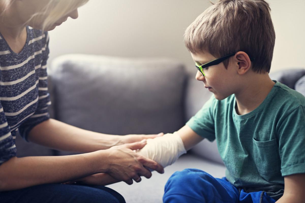 Patent tending to child's wounded arm
