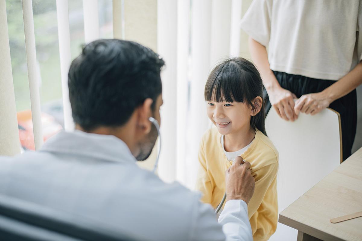 Smiling young child in doctor's appointment