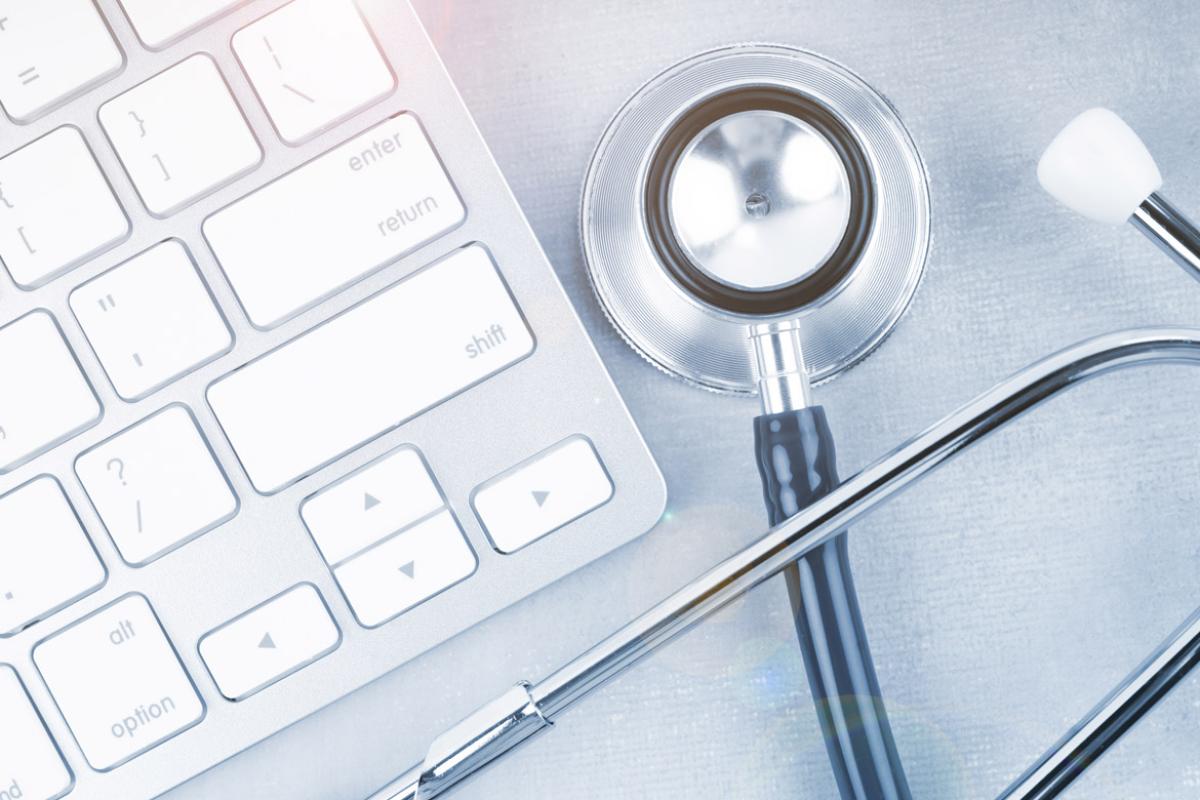 Stethoscope next to keyboard