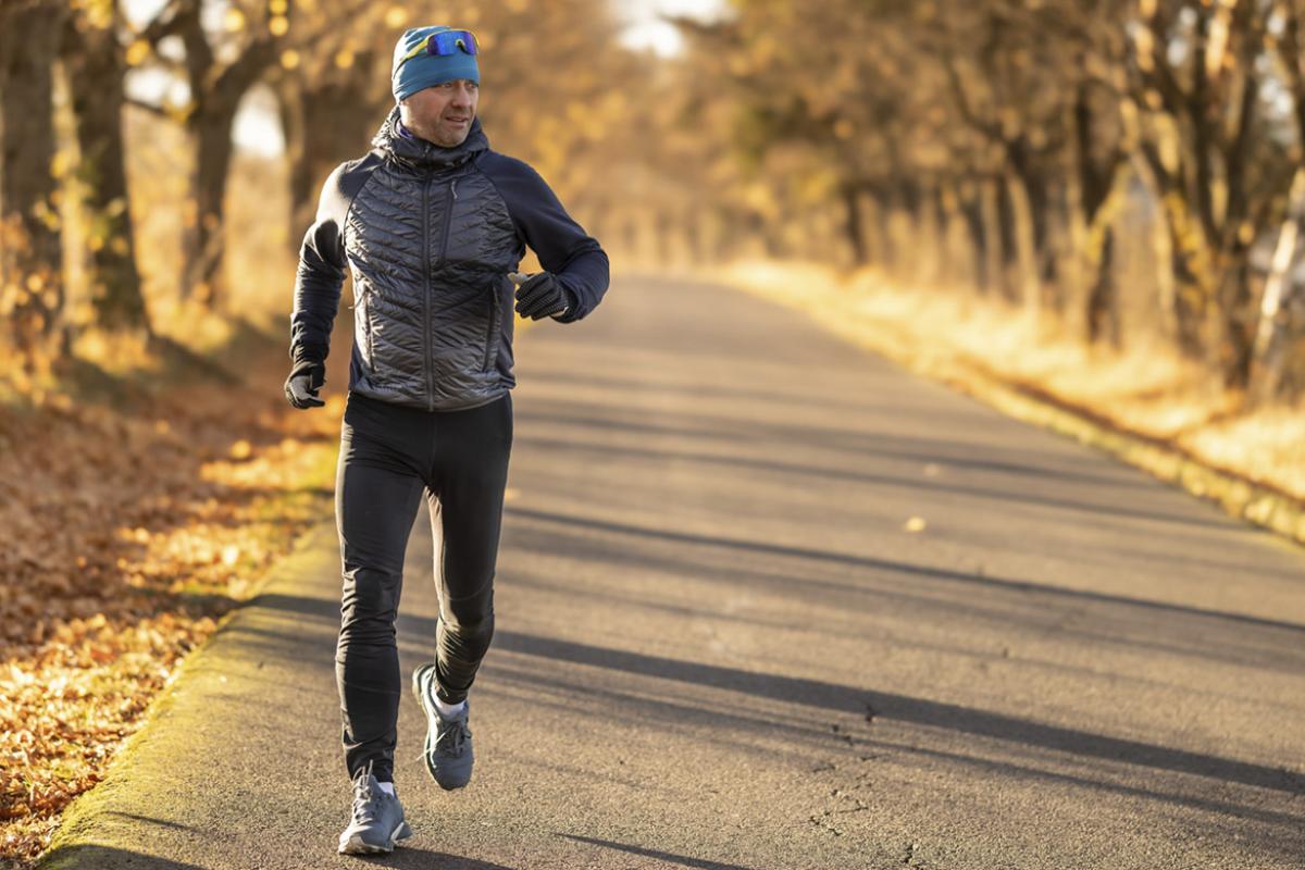 Runner on a rural tree-lined road