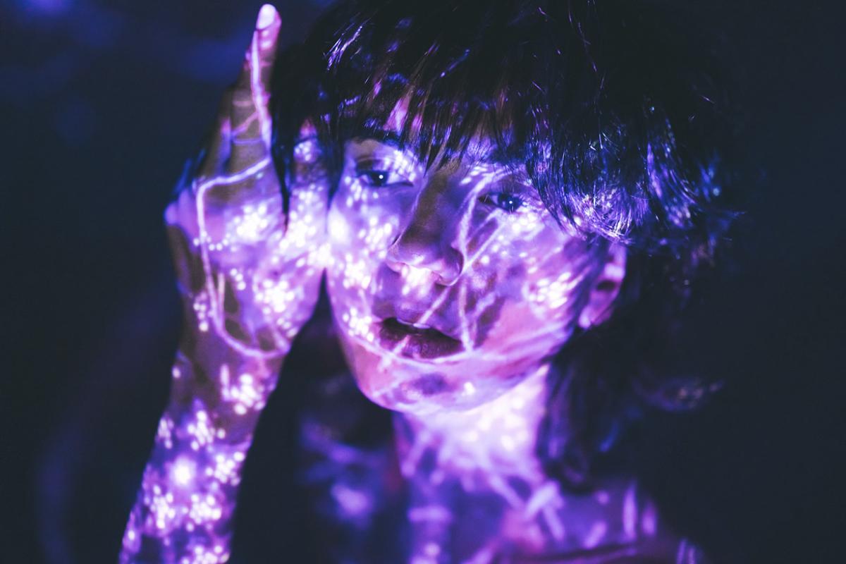 Person colored with bright psychedelic paint