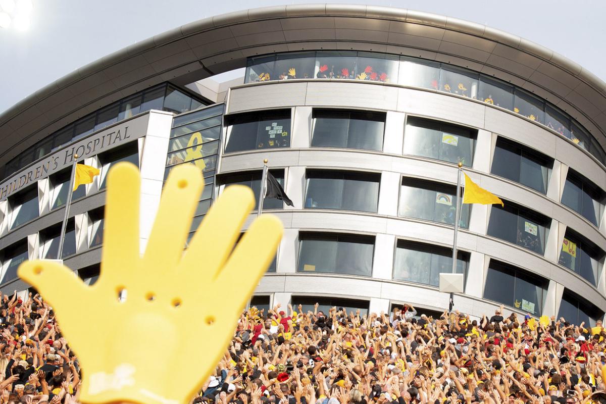 Fans wave to pediatric patients at the UI Health Care Stead Family Children’s Hospital 