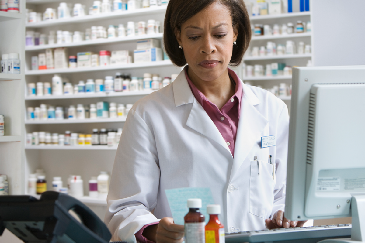 Pharmacist filling prescription