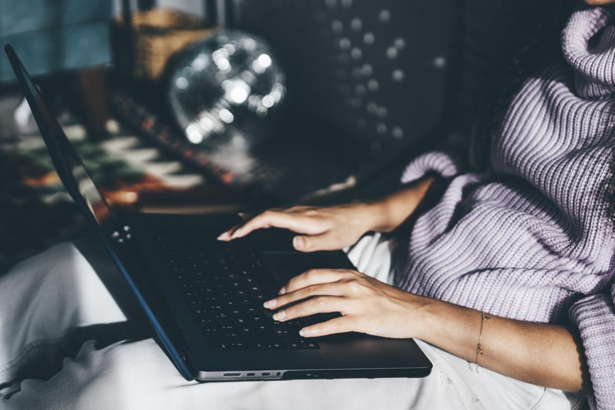 Person works with laptop working in living room