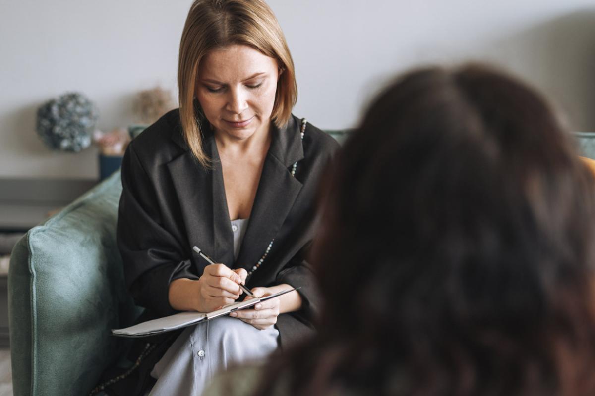 Young adult talking to psychologist