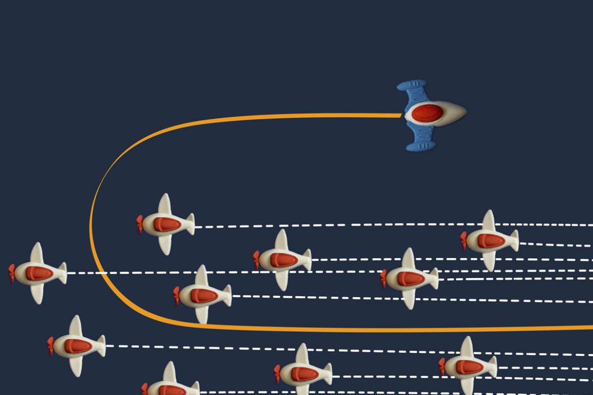 Group of airplanes with one flying in an opposite direction