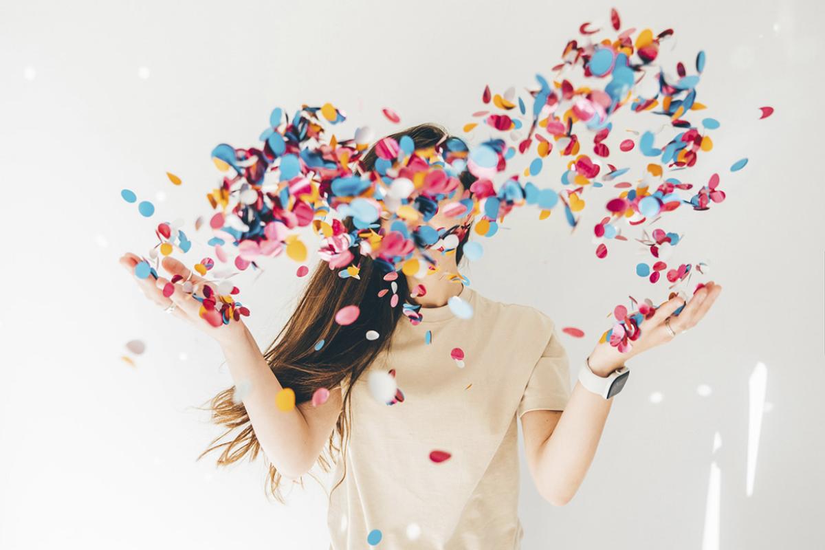 Woman celebrating with confetti