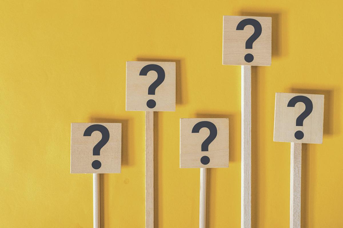 Wood poles with question mark symbols