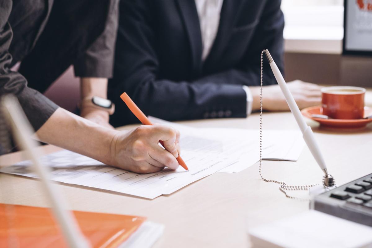 Person signing a contract