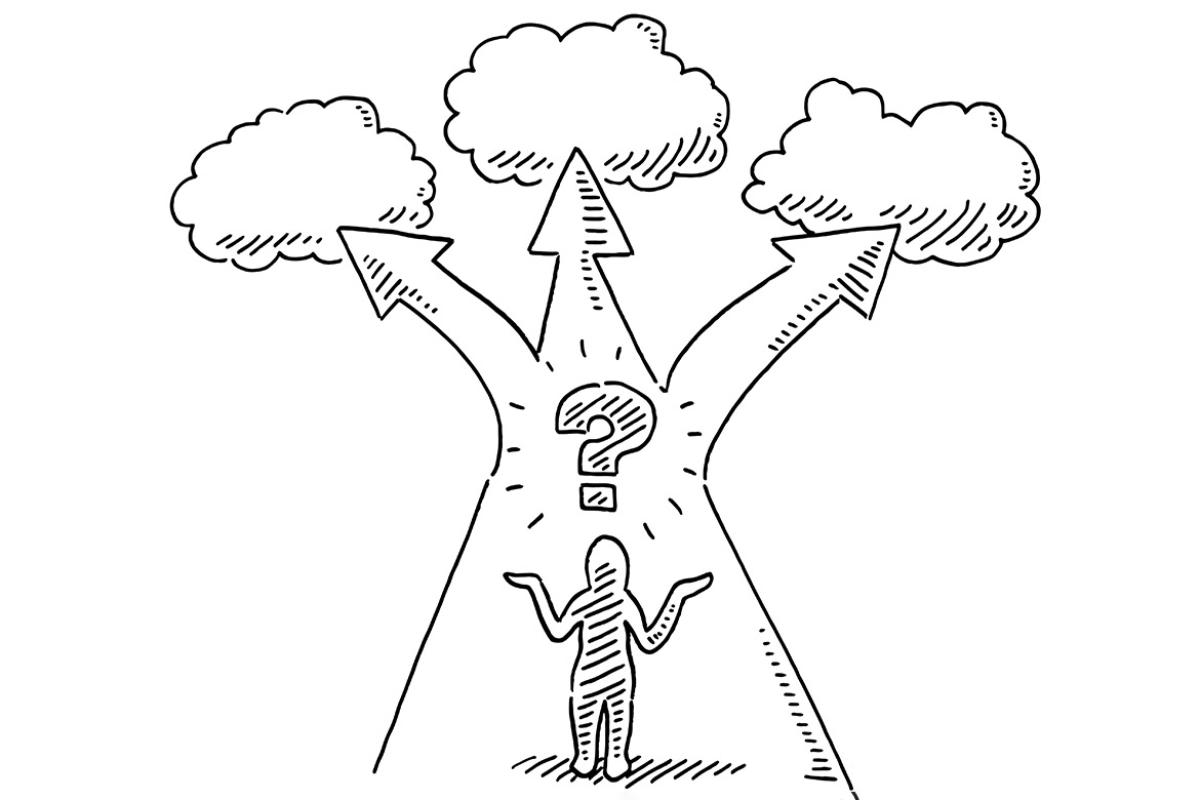 Figure stands in front of diverging paths