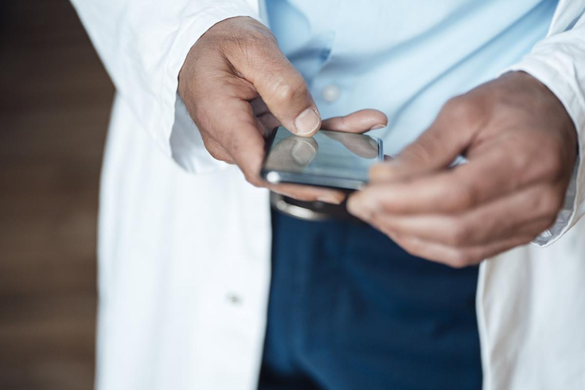 Hands hold a smartphone