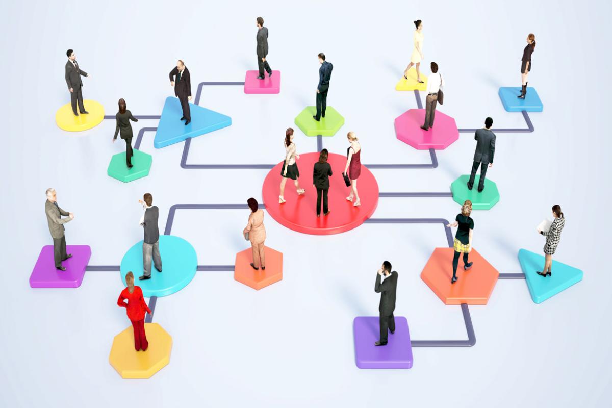 Figures stand on workflow chart