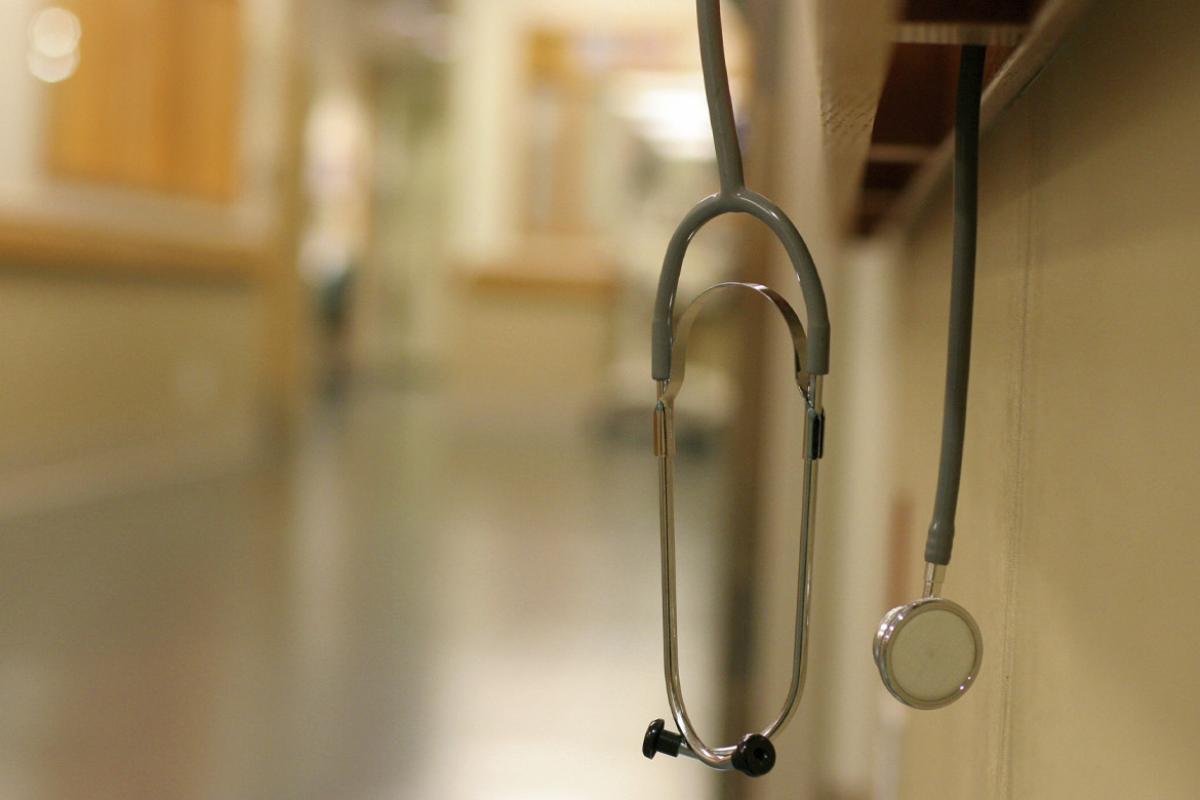 Stethoscope hanging on railing inside hospital