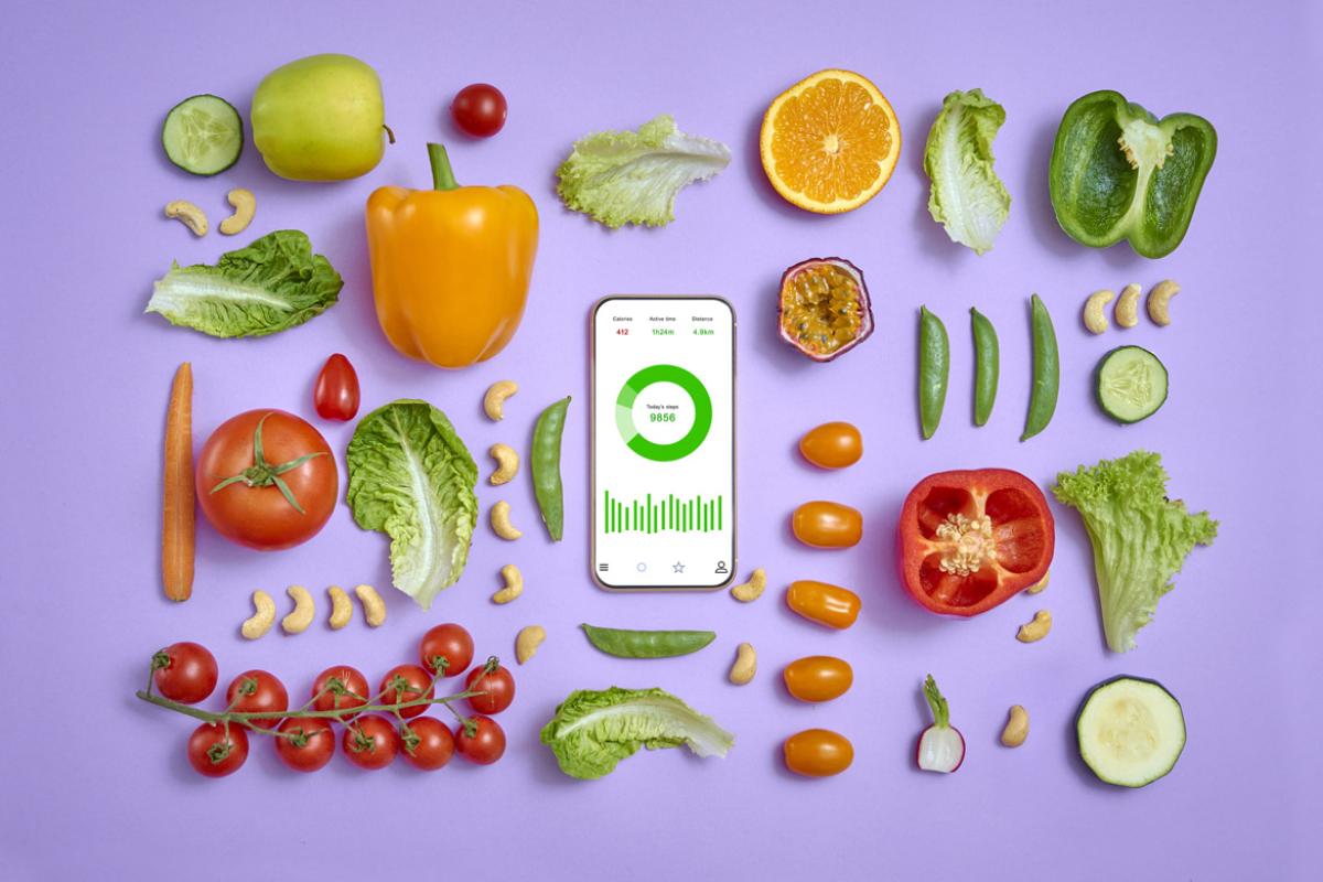 Fruits and vegetables surround smartphone