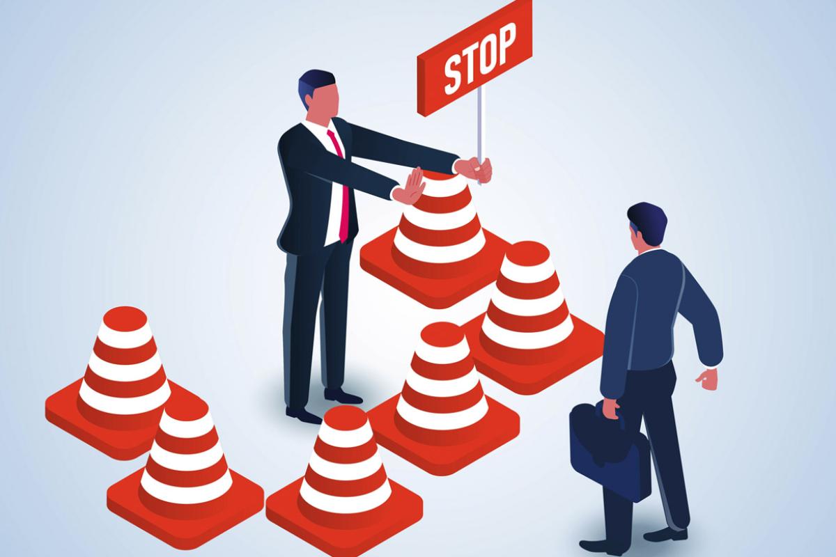 Figure holds a sign with the word stop toward another individual