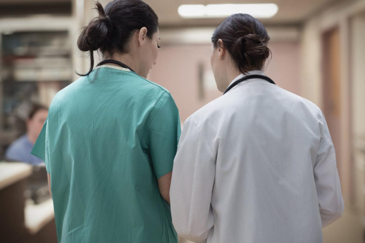 Two healthcare workers in discussion