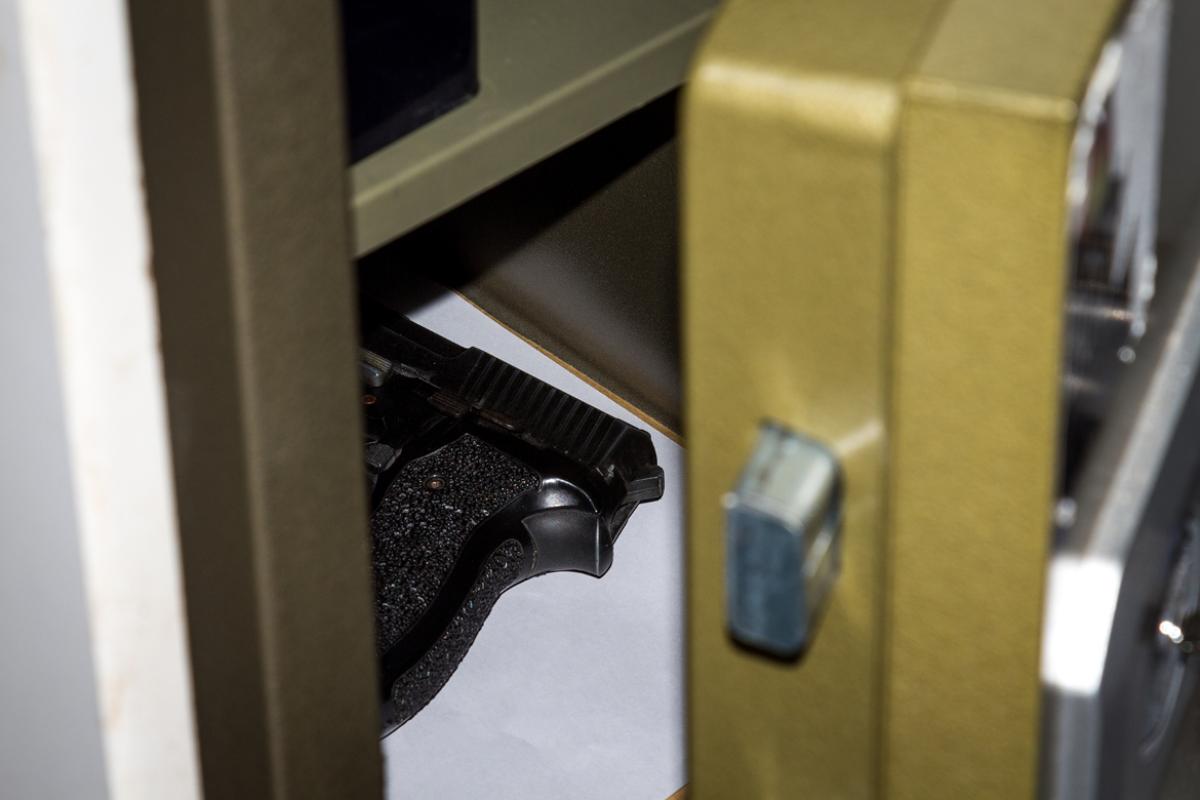 A photo of a gun in a safe.