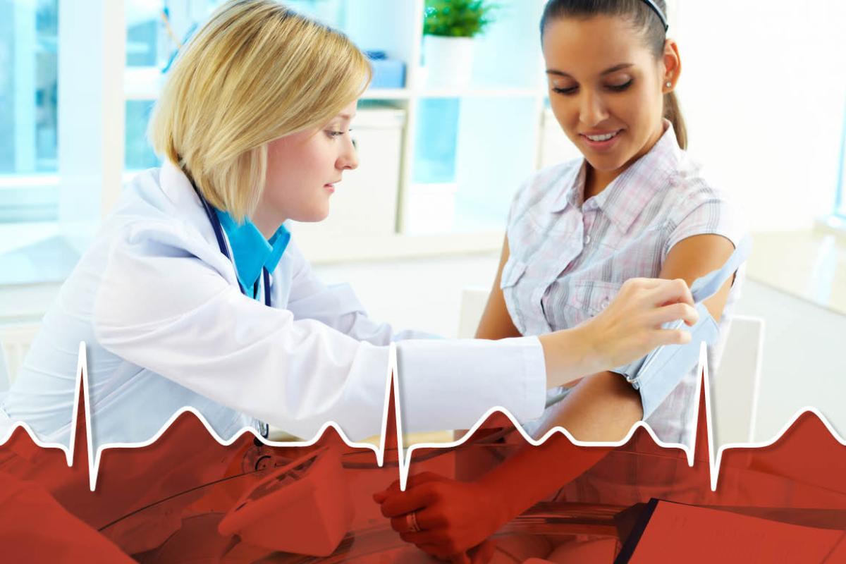 Physician taking patient's blood pressure.