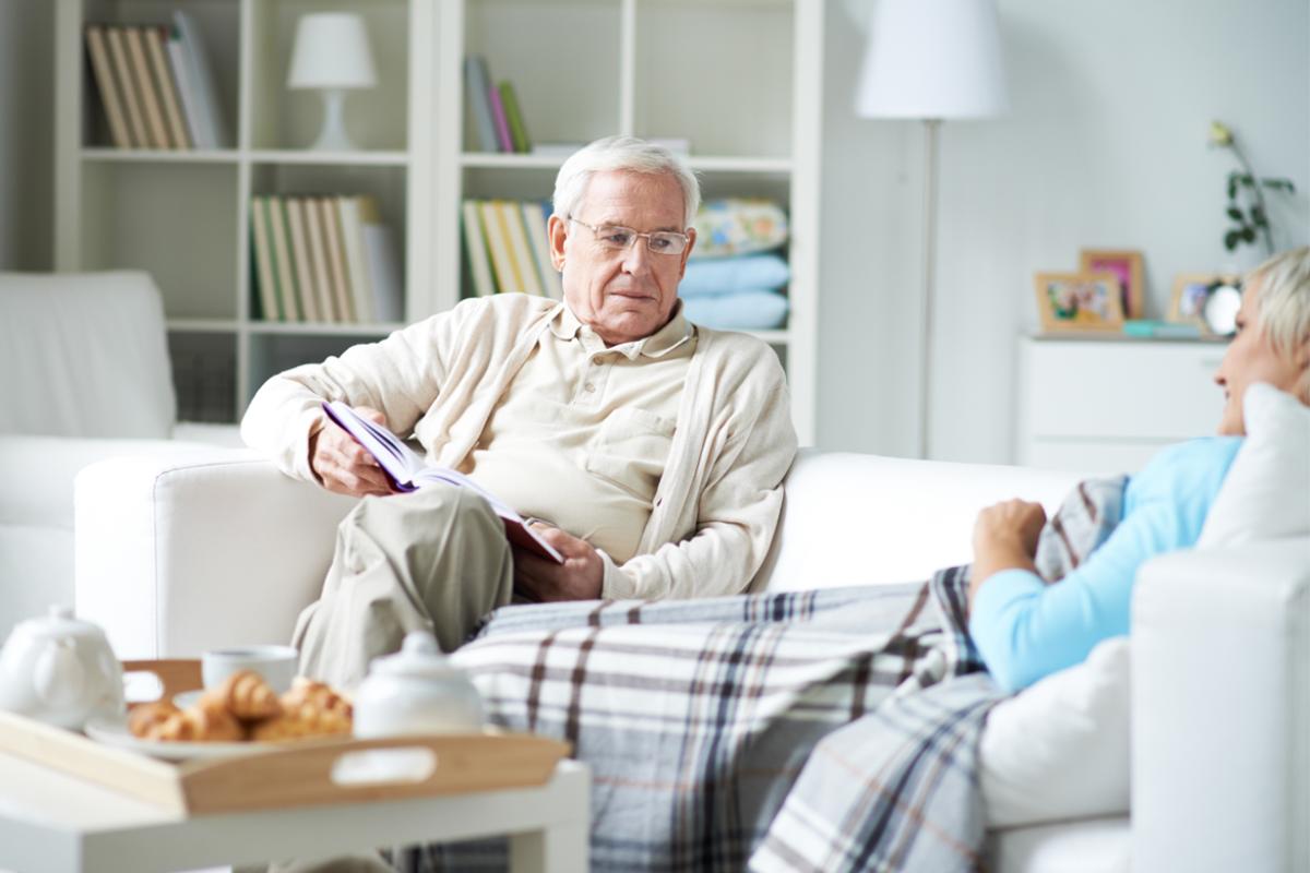 Man taking care of his wife at home.