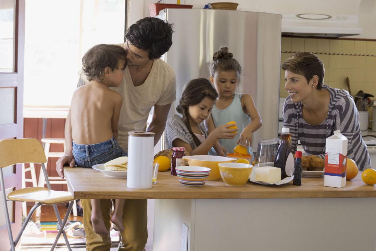 Family gathered around the morning kitchen island.