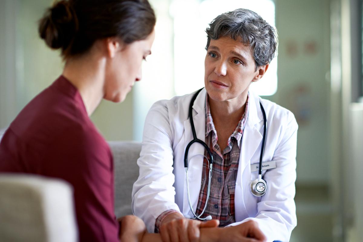 Physician comforts weary patient.