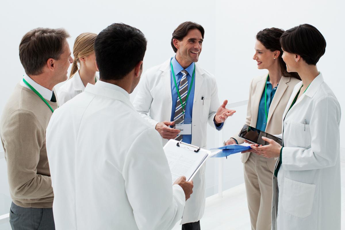 Group of physicians huddle against burnout.