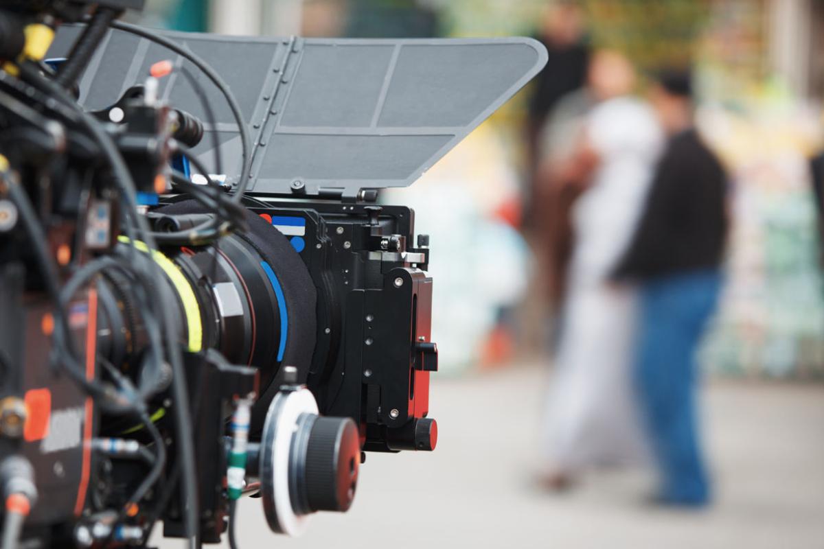 Camera lens pointing at talent.