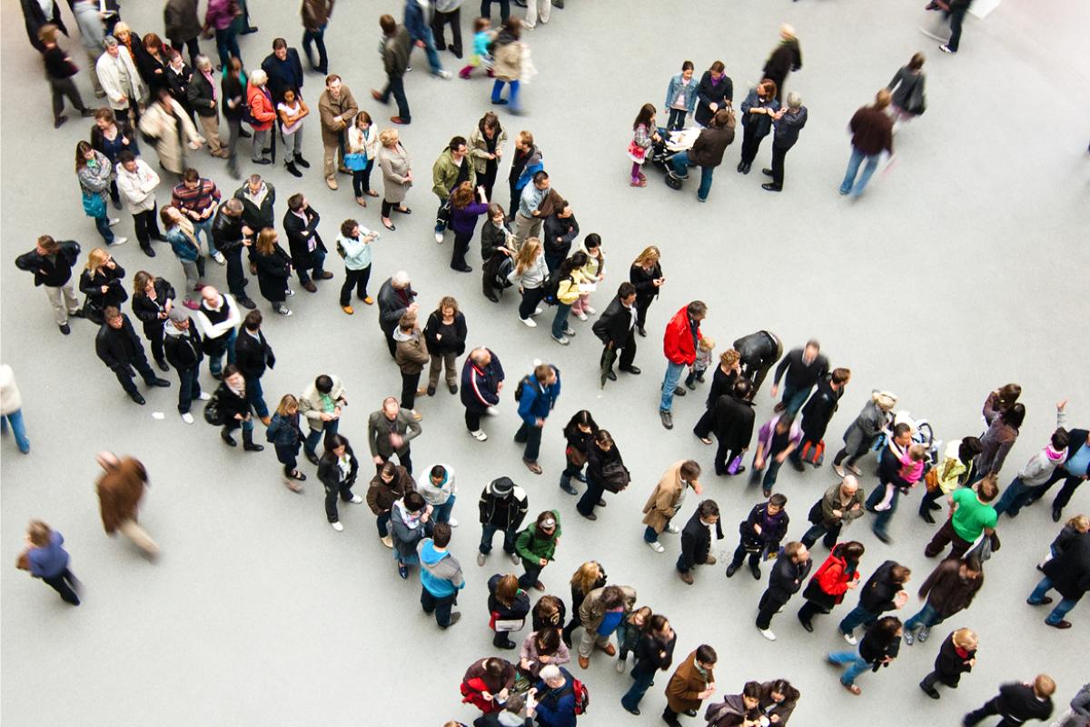 Overhead view of people lined up in a crowd. 