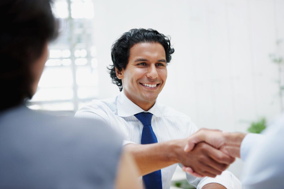 Man exchanges handshake